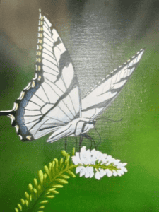 Painting of a white butterfly with black and yellow accents perched on small white flowers against a green background, created by Larry Lyannas.